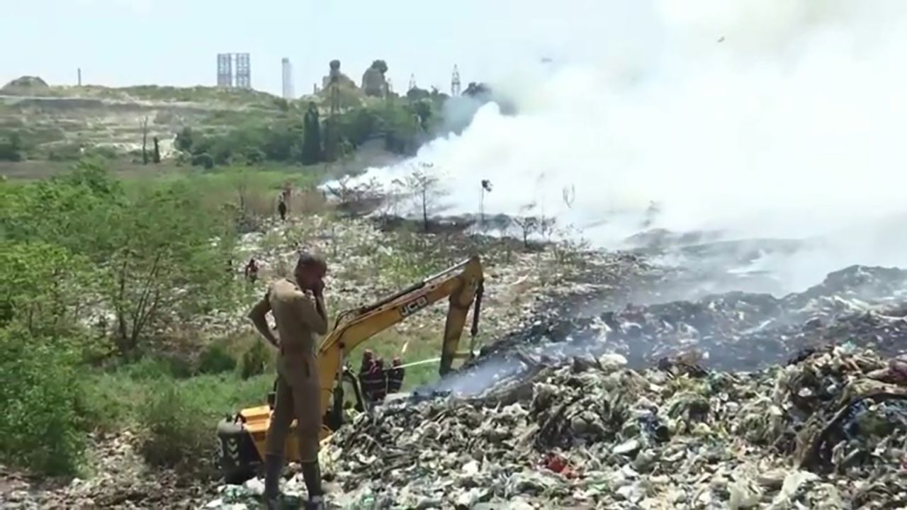 One of India’s trash mountains is on fire again and residents are choking on its toxic fumes